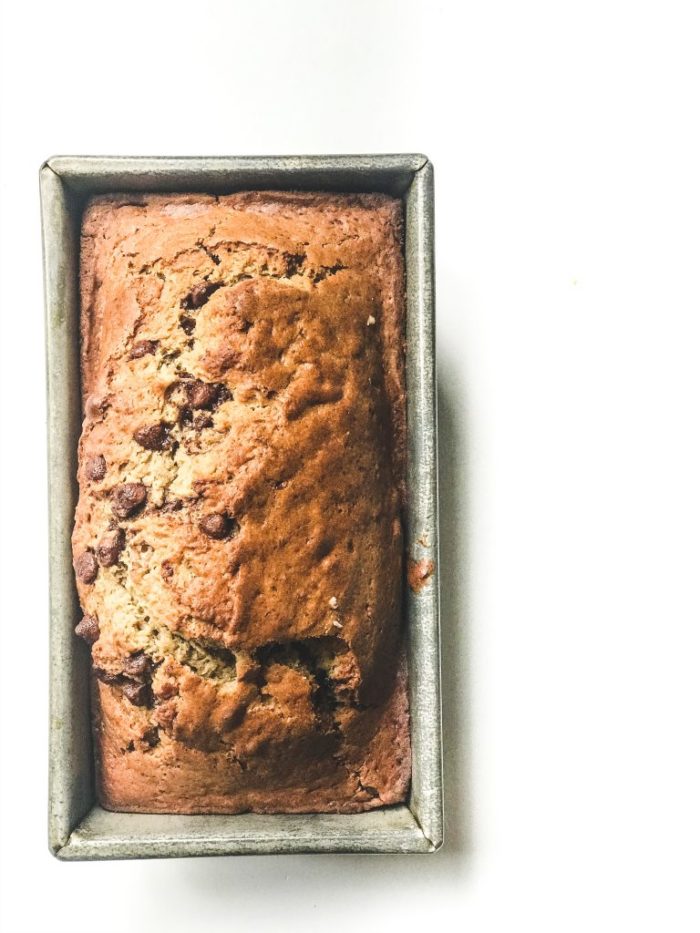 overhead view of sourdough banana bread in a loaf pan.