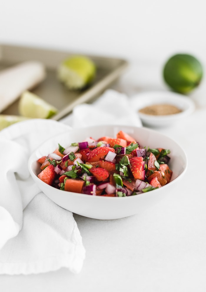 white bowl with fresh strawberry salsa. 