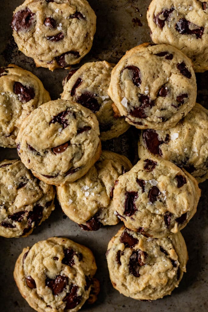 overhead view of sourdough chocolate chip cookies on a cooking tray.