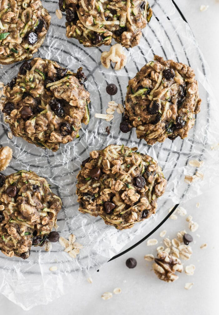 overhead view of zucchini oatmeal breakfast cookies on a round wire cooling rack.