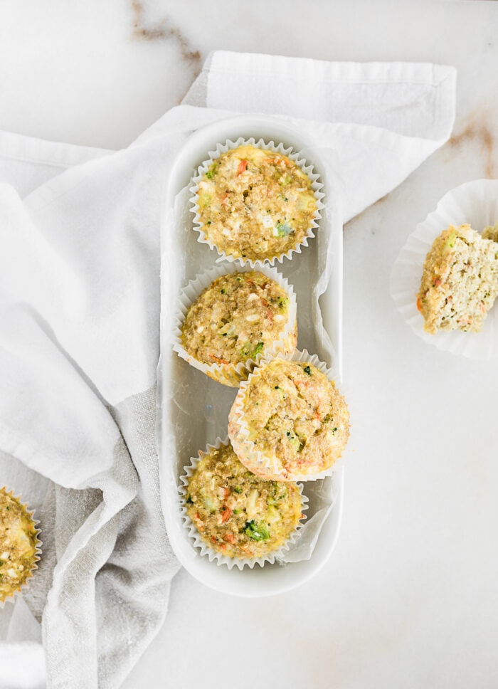 overhead view of quinoa muffins in a white oval dish.