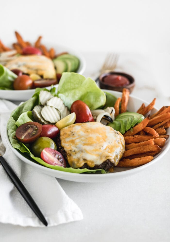 grilled cheeseburger bowl in front of another burger bowl.