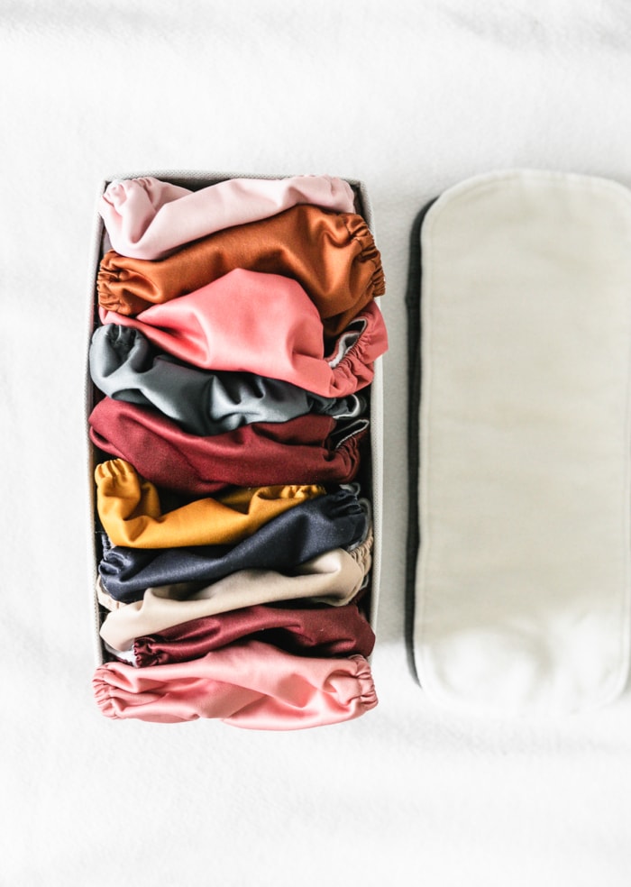 cloth diaper shells folded in a drawer box.