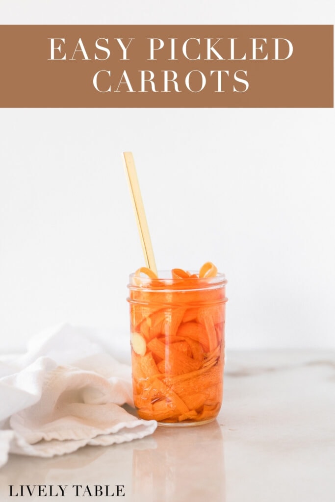 jar of pickled carrots with a gold fork in it and a white napkin beside it with text overlay.