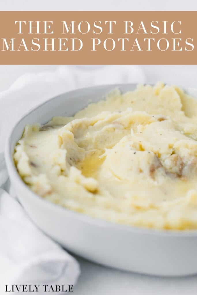 closeup of rustic mashed potatoes in a grey bowl with melted butter on top with text overlay.