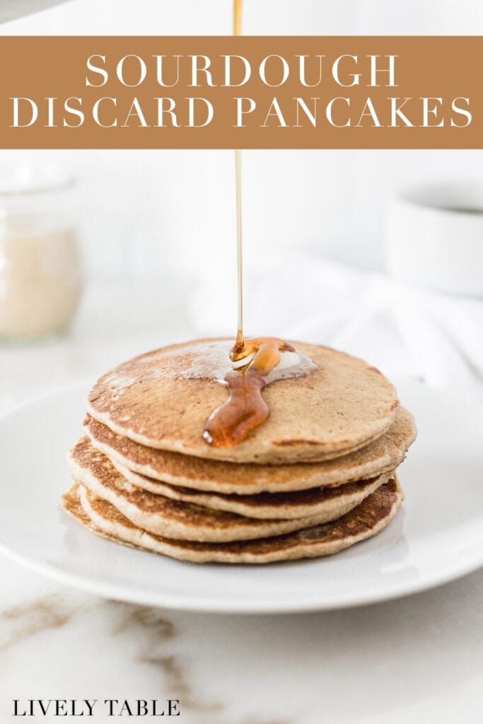 syrup being poured over a stack of sourdough discard pancakes on a white plate with text overlay.