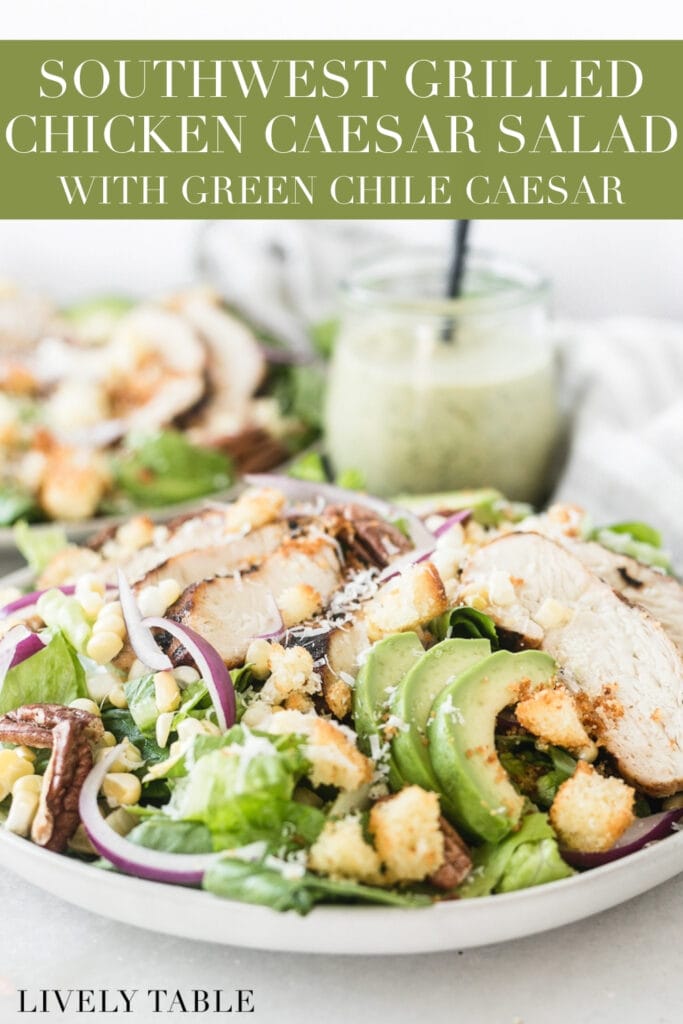 southwest grilled chicken caesar salad on a grey plate with a jar of green chile dressing in the background with text overlay.