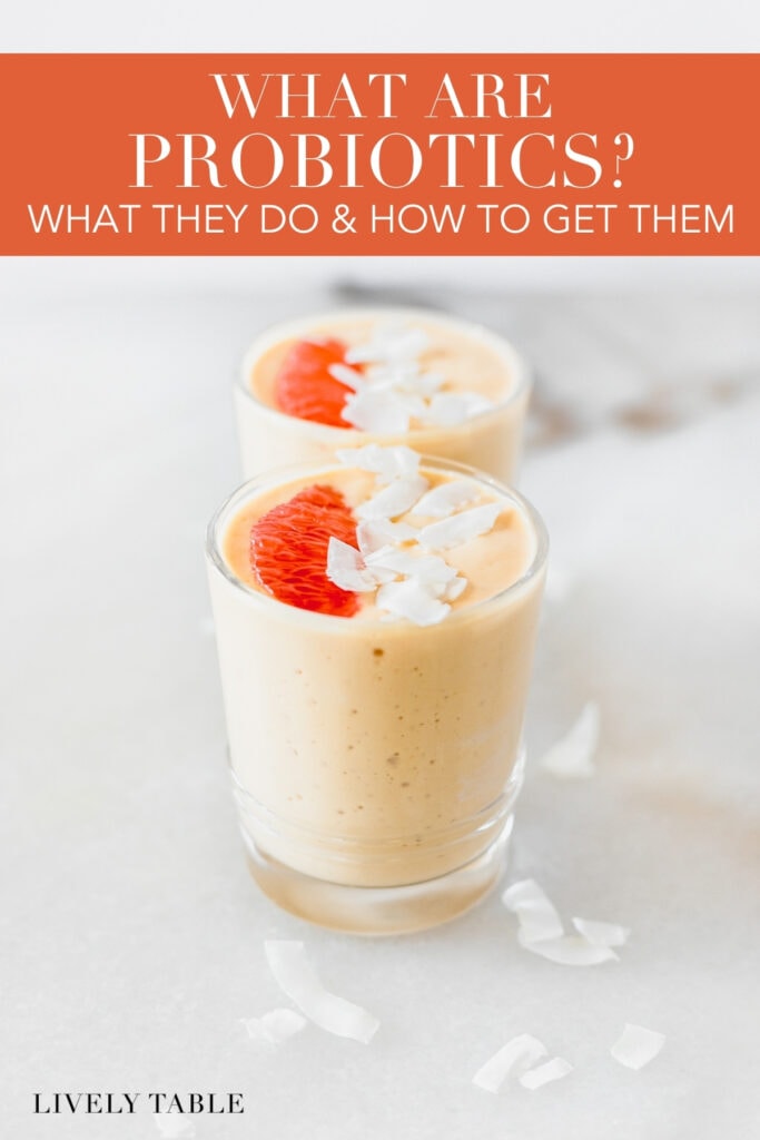 two smoothies topped with coconut and grapefruit with text overlay.