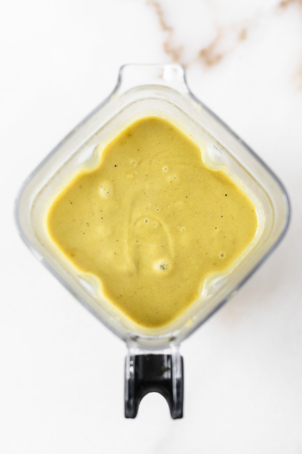 overhead view of blended split pea potato soup in a blender.
