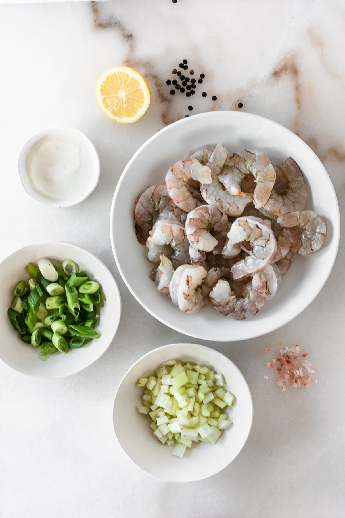 overhead view of ingredients needed to make shrimp salad for shrimp rolls.