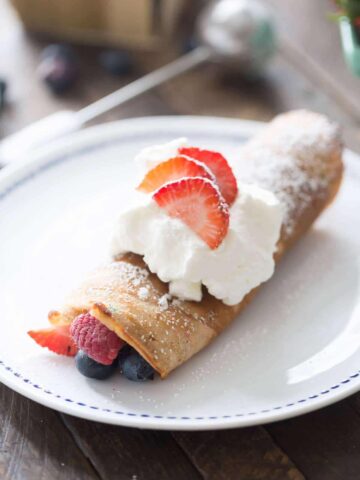 Most crepes start with flour. These use a shortcut ingredient that creates colorful layers ready for berries, whipped cream, and Fourth of July celebrations.